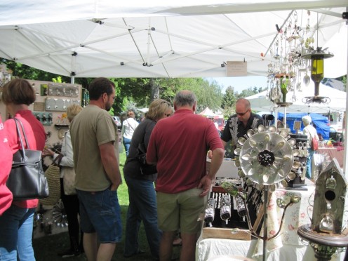 When I arrived, most booths were almost empty. As you can see, Dan's art made of recycled knives, forks, and spoons are very popular. People are actually standing in line to buy, and they just kept coming. His items are in demand. Click to enlarge