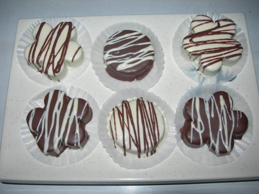 chocolated coated homemade polvorons in white and dark chocolate and drizzled in extra melted white and dark chocolate.