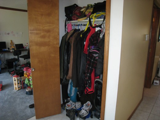 My cluttered closet.  Yes, there is a life jacket in there. No clue how that ended up in there.  