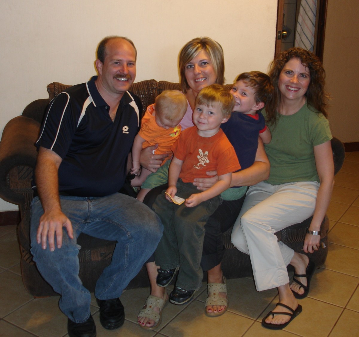 Jason Tressa and their three young children.  Michelle from our team is in the middle.