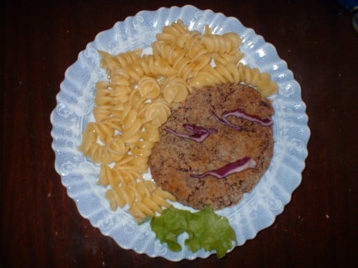 What's in your child's happy meal? This one has pasta, a bean-burger and salad (it had more salad but the picture looked better like this)