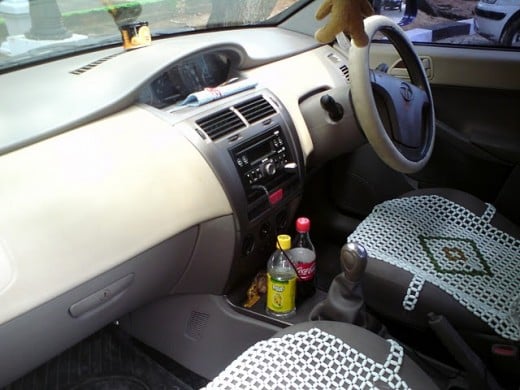 Interiors including steering, dashboard, and seats of Indica Vista Aura Quadra