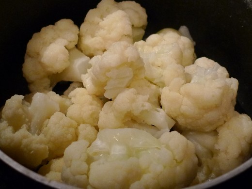 Cauliflower is boiled and drained