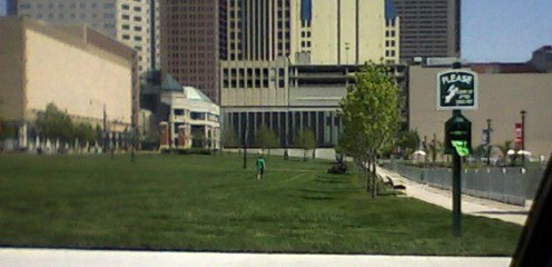 Part of the Columbus Commons undergoing a manicure on Memorial Day 2011. A line of small gardens is fenced off at the right side of this photo.