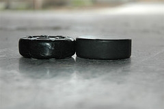Shown here are an original puck made from a ball and the modern counterpart.