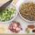 Here are the ingredients for this delicious dish!  Shown here are chopped onion, celery, green bell pepper and garlic.  Also chopped country style bacon, whole bay leaves, red pepper flakes, creole seasoning and dried blackeyed peas (soaked in water)