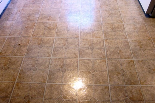When I pulled the washing machine out from its nook, I ripped the flooring beyond repair, so Emily and I spent the evening re-tiling the floor. Turned out pretty decent for our first experience.