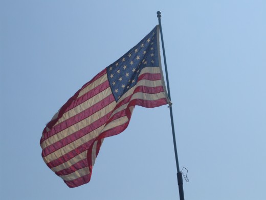 Six rows of eight stars fill the blue field in the 48-star flag of the United States of America flown all through World War II.