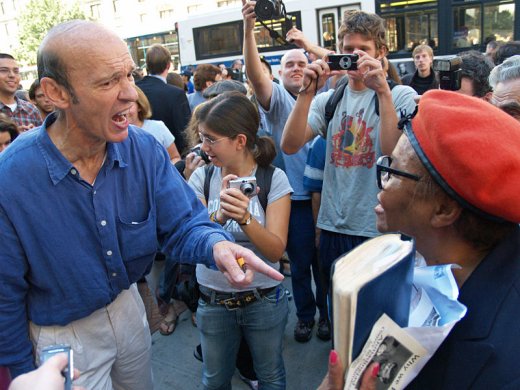 Pointing a finger in anger at a political protest.