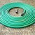 This is a green vinyl hose with a spray nasal for watering your plants and grass. 