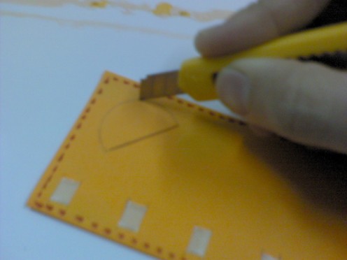 Cut out the semi-circle with a penknife