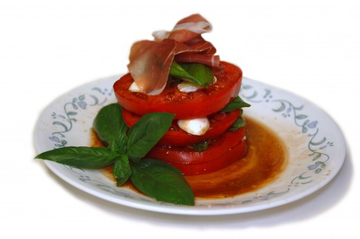 Caprese Salad stacked up with Prosciutto on top