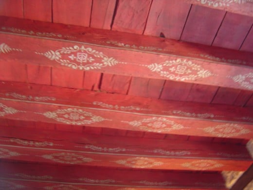 The painted ceiling of the red bedroom