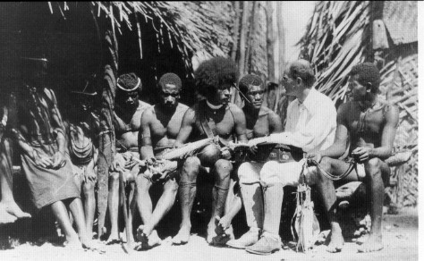 Bronislaw Malinowski, founder of the theoretical orientation known as functionalism, performing fieldwork on the Trobriand Islands.