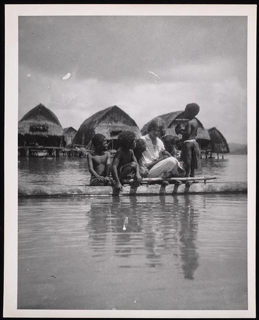 Margaret Mead, theorist of culture and personality, spending time with children on the island of Samoa.