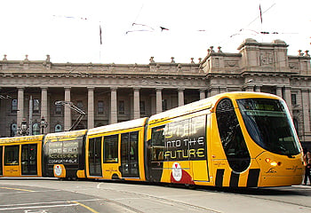 Tram on Bourke Street with the Parliament of Victoria in the background. 