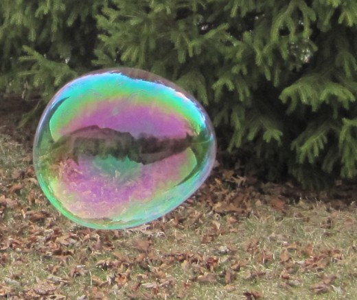 A house reflected within a bubble.