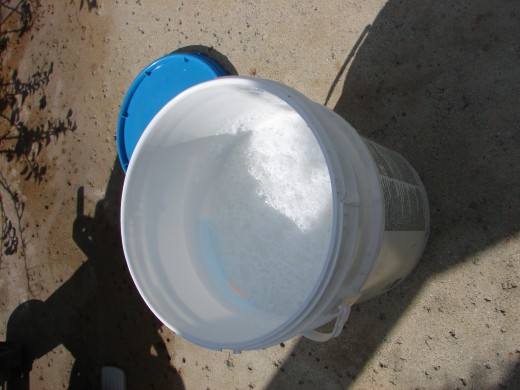 Mix the melted soap and the borax and washing soda into a clean 5-gallon bucket. Add enough water to fill it halfway - then let it sit overnight.