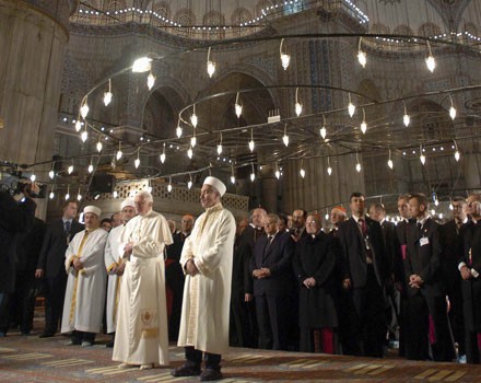 Pope Benedict XVI prays alongside Mustafa Cagrici, the grand mufti of Istanbul, in the Turkish capitals Blue Mosque in November 2006