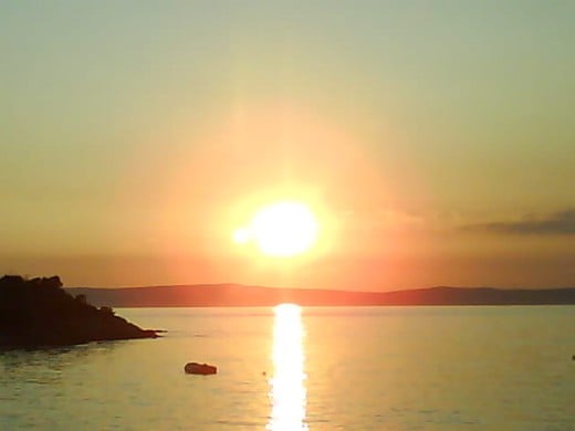 Insel Rab, Croatia - My children were inspired taking pictures from the exotic rarely amazing sunset as our dinner arrived.