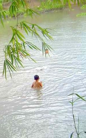 Children Taking a Bath in the River (Summer of 2010) Photo by Travel Man