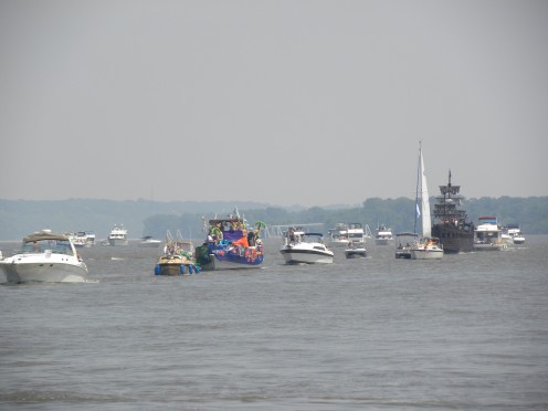 Parade of boats approaching the Shrine of  Our Lady of the Rivers at Portage des Sioux