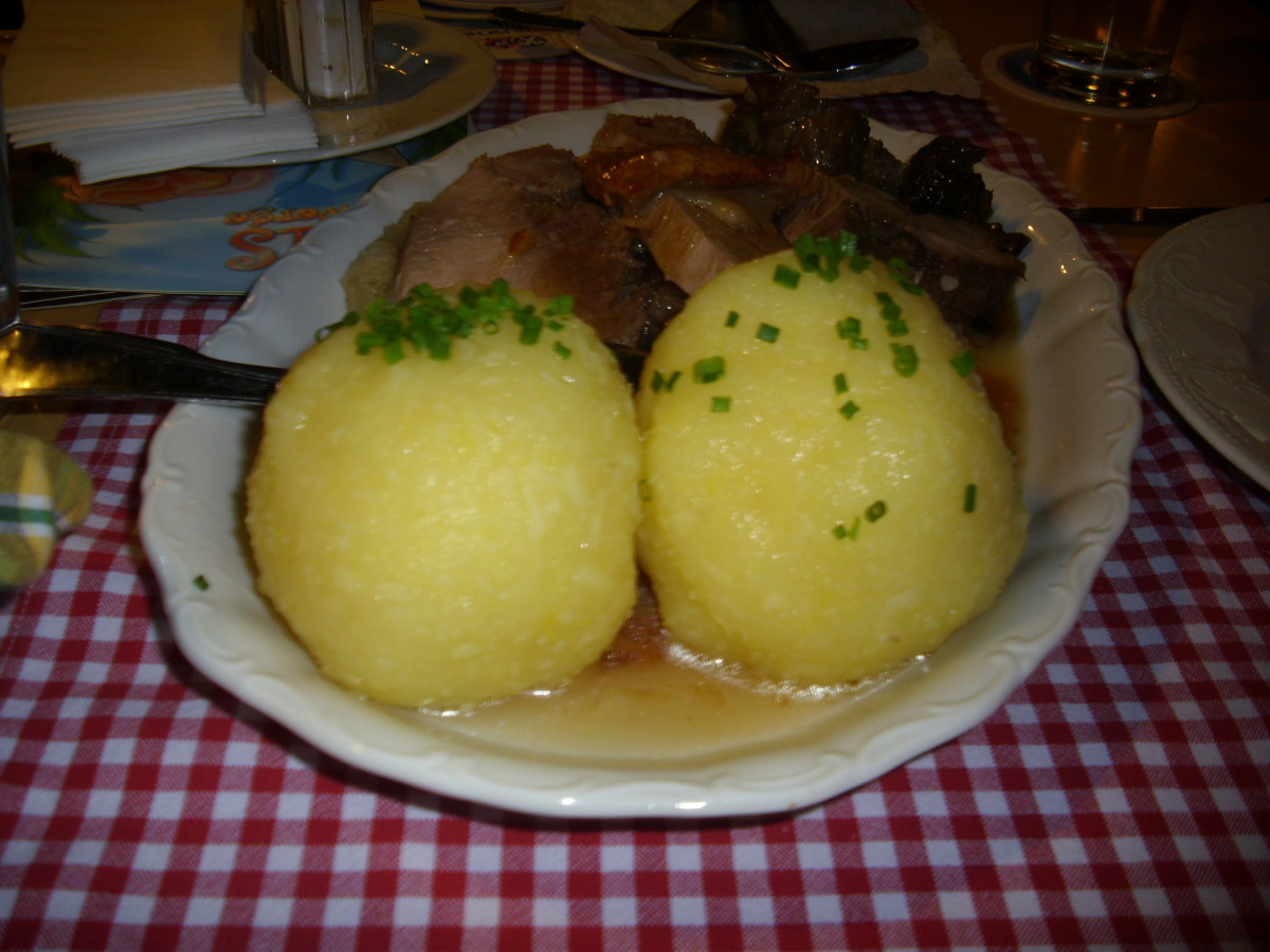 Roasted Pork with Potato Dumplings, Sauerkraut  and brown  gravy