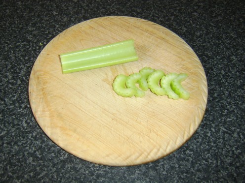 The celery is sliced in to small kidney shapes