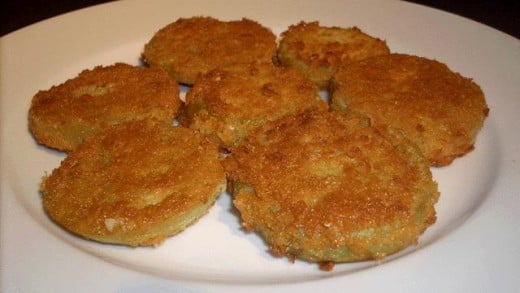 A plate full of fried green tomatoes