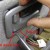 Push down on the lower Handle Bezel and pull to release the lower connection Push down on the lower Handle Bezel and pull to release the lower connection