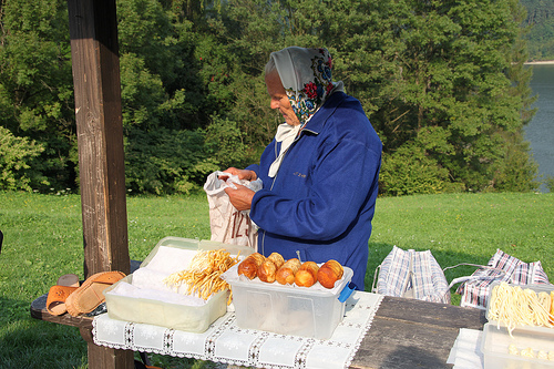 A Polish grandmother selling her own smoked cheese made with salted sheep's milk.