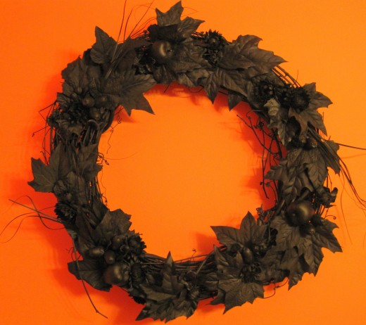 Black Halloween Wreath - crafted from existing fall wreath spray painted black.