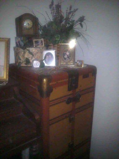 This antique steamer trunk stores winter quilts and heavy coats throughout the warmer months.