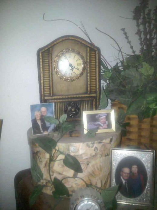 A hat box not only protects and preserves a hat, but it placed under a clock, it becomes part of the decor of the room.