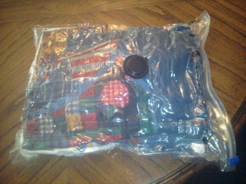 This bag has 2 sweatshirts, 2 vests, a denim dress and 2 sweaters condensed to the size of one folded sweatshirt!