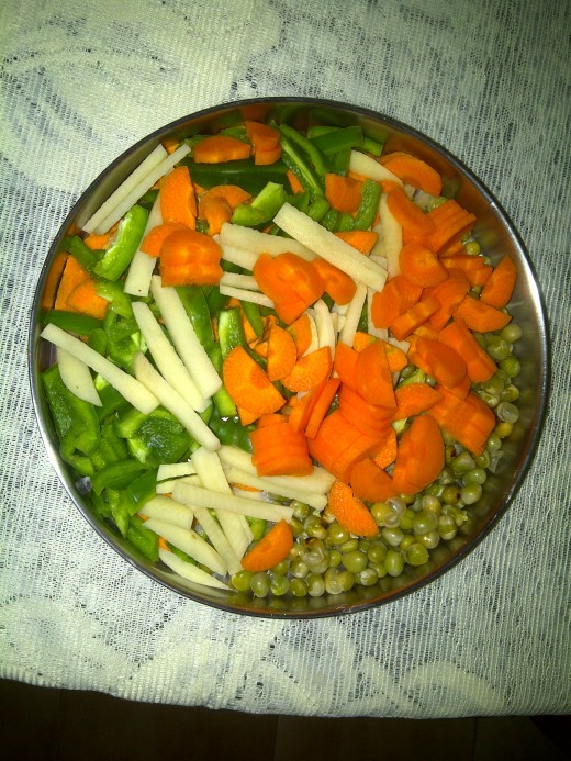Carrots, green bell pepper, potato and green peas
