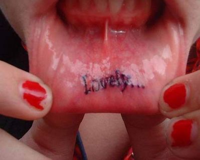 Blurred lip tattoo