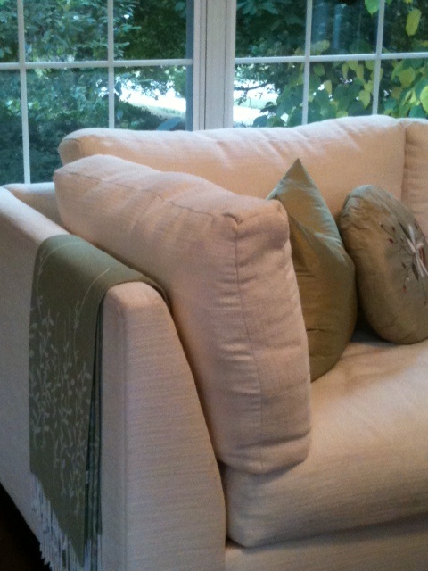 Eliminate window dressing, add a throw and pillows to comfortable sofa for change