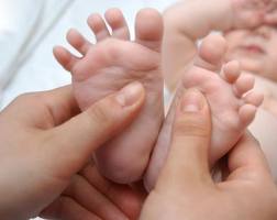 Massage baby from head to toe