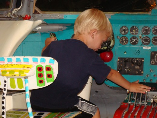 Alex pretending to be a pilot.