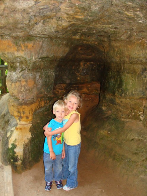 Grace and Alex in a little mini cave at the falls.