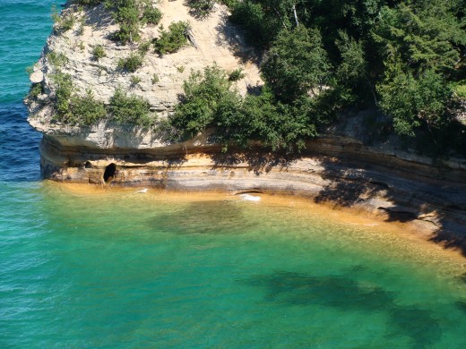 The beautiful blue green shoreline at the bottom of Miners Castle.