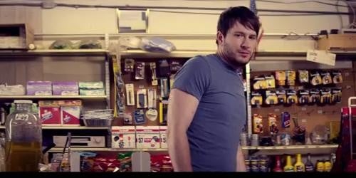 Adam peruses the shelves of a convenient store and locks eyes with a beautiful girl.  Or does he?