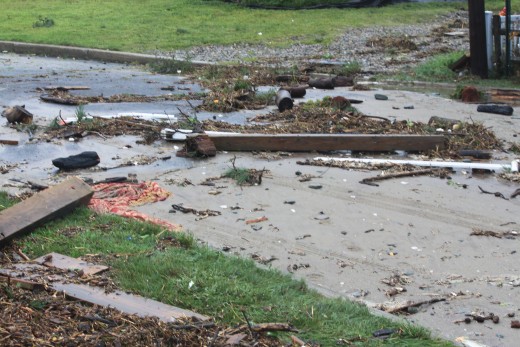 debris from how high Storm surge rose 