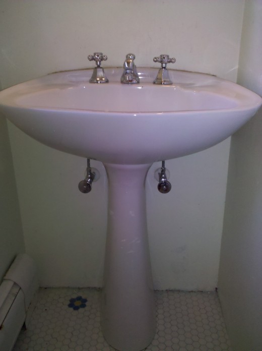 Pedestal Sink found in many bathrooms. These are attractive for smaller spaces because the plumbing is hidden and there is no Vanity Unit required.