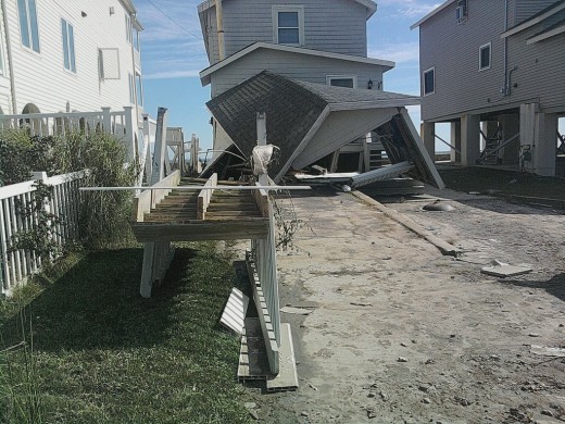 I took this photo with my cell phone of the destruction along the beach to people's homes in MIlford, Ct from hurricane Irene, the waves crashed right through bottom floors!