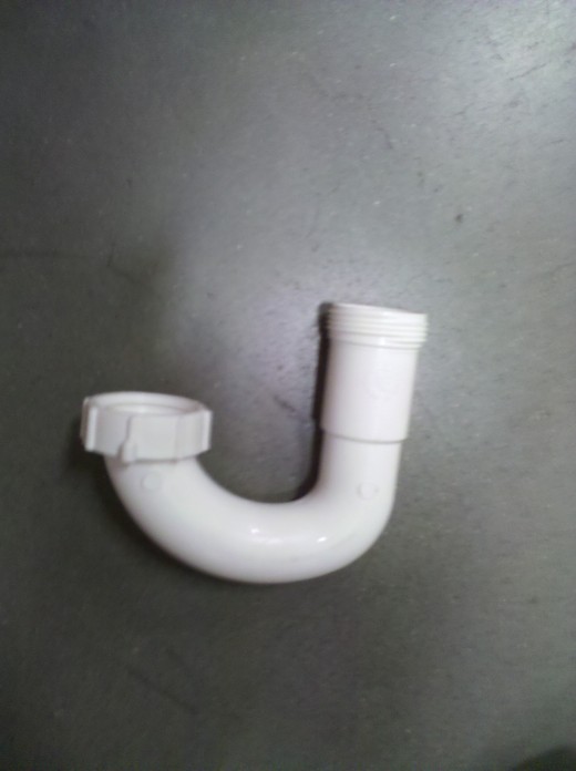 Standard P-Trap used in sinks and other waste draining systems. These are designed to allow a little bit of water to sit in the flat side of the curve so that toxic gases can't seep into the air.