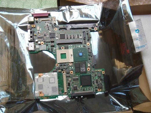 Motherboard without the battery holder indicating that it has not been used before.