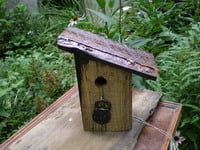 Rustic Bird House with Padlock Detail