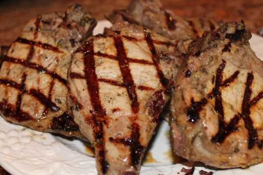 The perfect pork chop that your going to grill should be about an inch thick and there should be some fat on the pork chop and for the best flavor the bone should be on the pork chop.